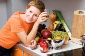 Girl at the table with healthy products